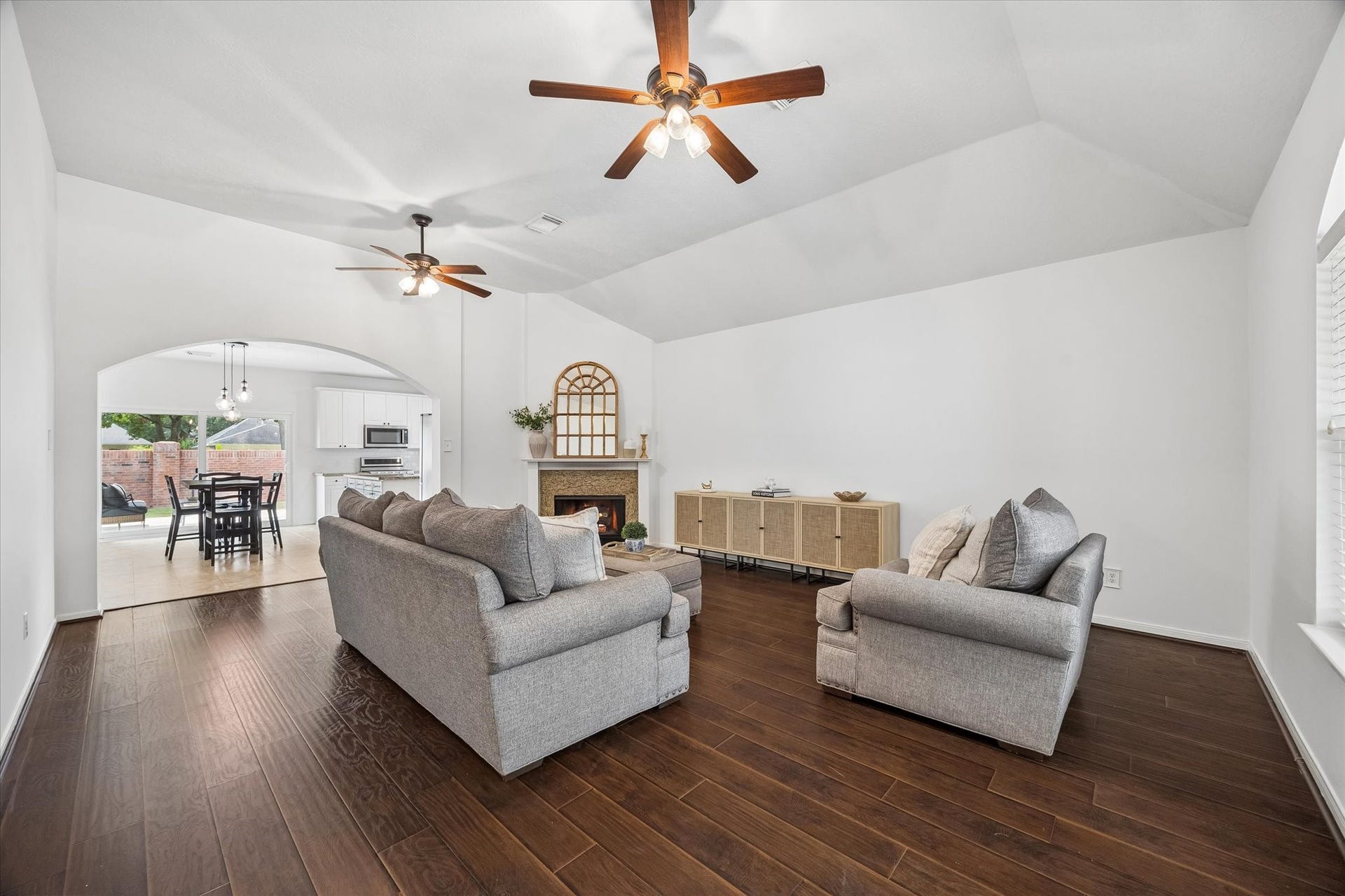 The spacious living area offers an easy flow into the dining area and kitchen, perfect for everyday living and entertaining.