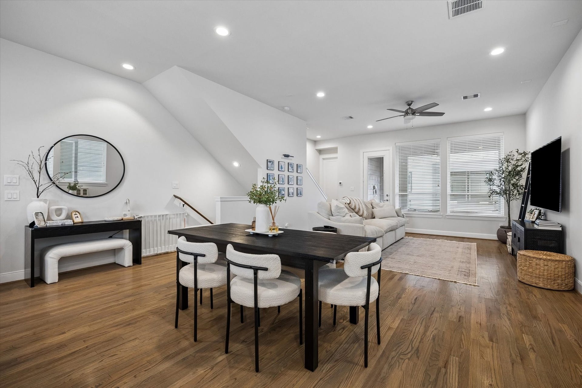 2491 W 11th Street, Houston, TX 77008 Dining area is conveniently positioned between the living room and kitchen, creating an easy flow for entertaining. Hardwood flooring continues throughout the open living space.