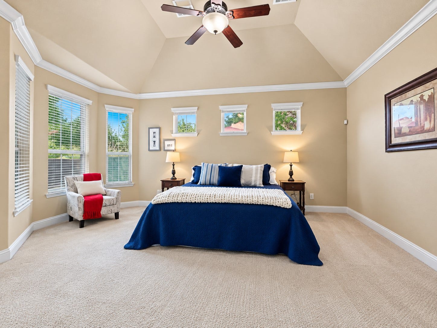 59 Tioga Place, Tomball, TX 77375 High ceilings and tall windows give the primary suite an open feel, while natural light creates a relaxing atmosphere.