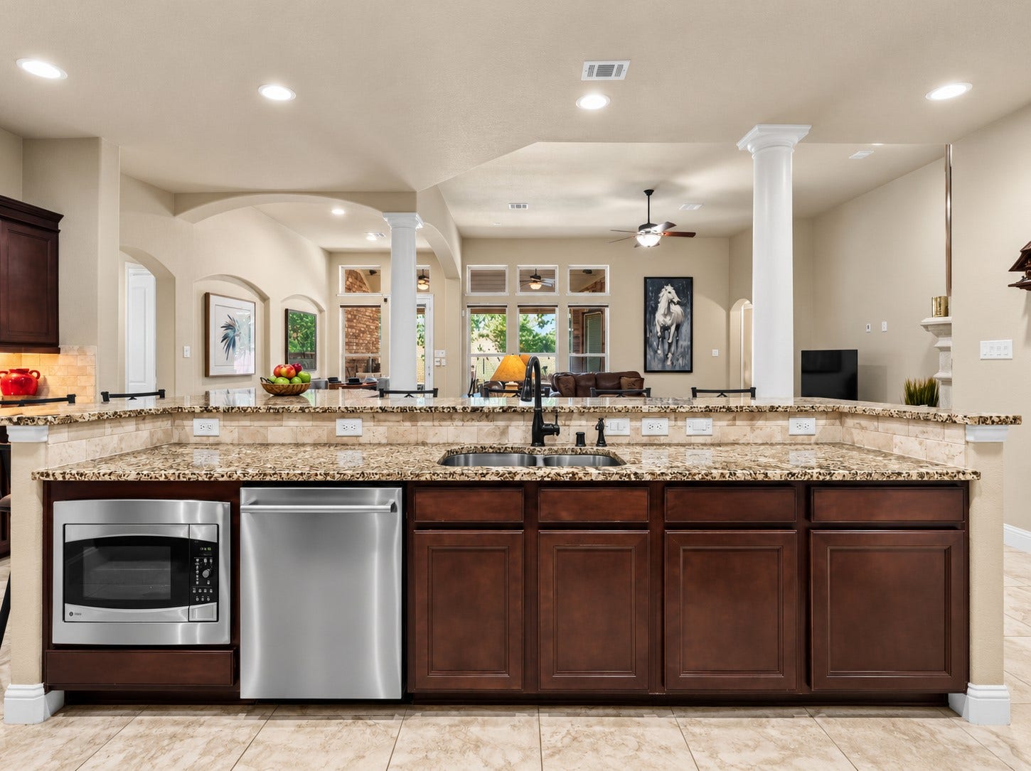 59 Tioga Place, Tomball, TX 77375 Open to the living and dining areas, the kitchen keeps everyone connected whether you're preparing dinner or hosting friends.