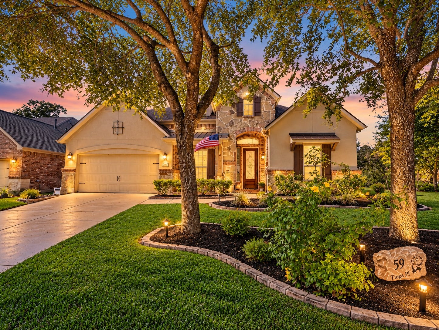 59 Tioga Place, Tomball, TX 77375 Welcome to this beautiful 1.5-story home in The Woodlands Creekside Park. Evening lighting and manicured landscaping give the home a warm, inviting presence after sunset.