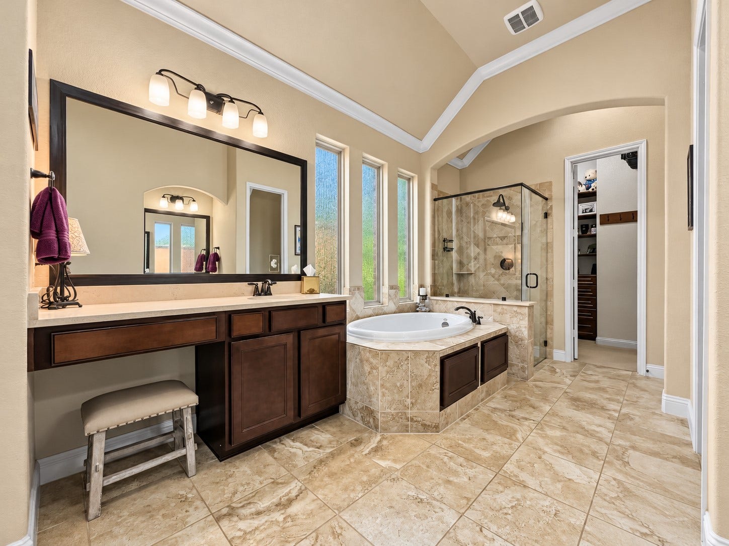 59 Tioga Place, Tomball, TX 77375 With two sinks and a dedicated vanity area, the bathroom offers practical space for getting ready without feeling rushed. Enjoy the best of both routines with a large soaking tub for relaxing evenings and a separate shower for busy mornings.