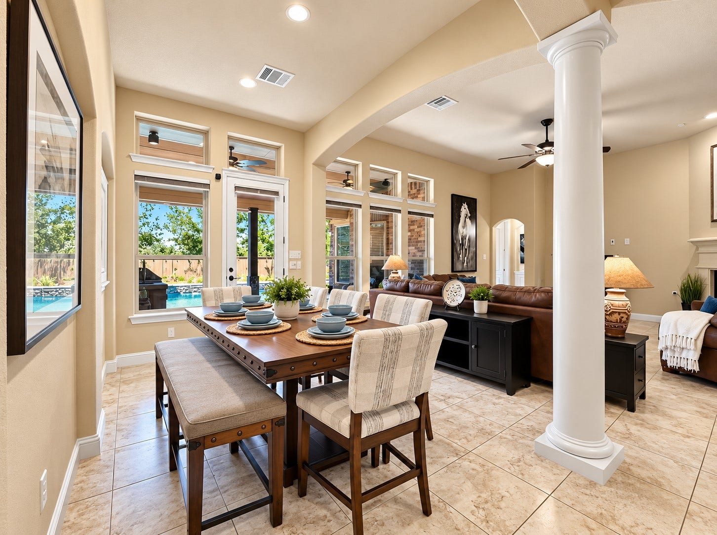 59 Tioga Place, Tomball, TX 77375 An open connection between the dining space and kitchen makes everyday dinners and casual get-togethers feel comfortable and connected.
