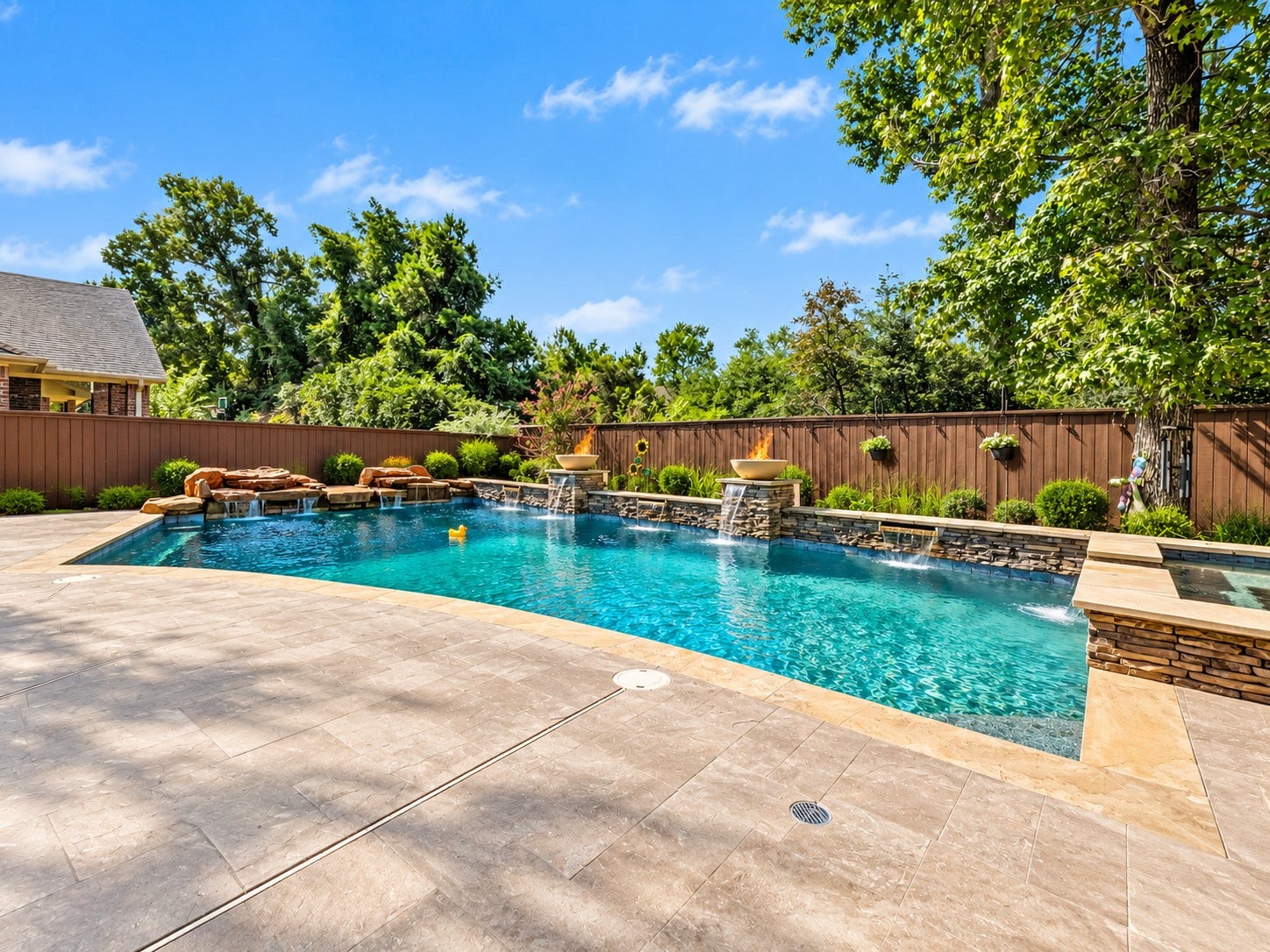 59 Tioga Place, Tomball, TX 77375 A private outdoor retreat awaits, offering a place to cool off during warm Texas days or unwind in the spa after a busy week.