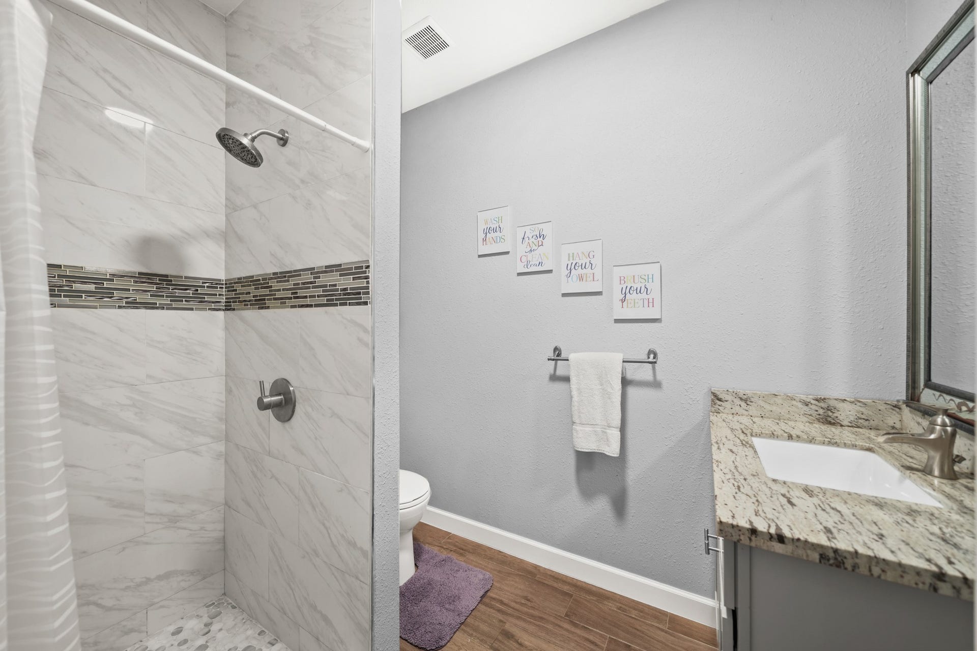 11021 32nd Street, Santa Fe, TX 77510 Secondary Bathroom 1: Highlights the glass shower doors and granite vanity