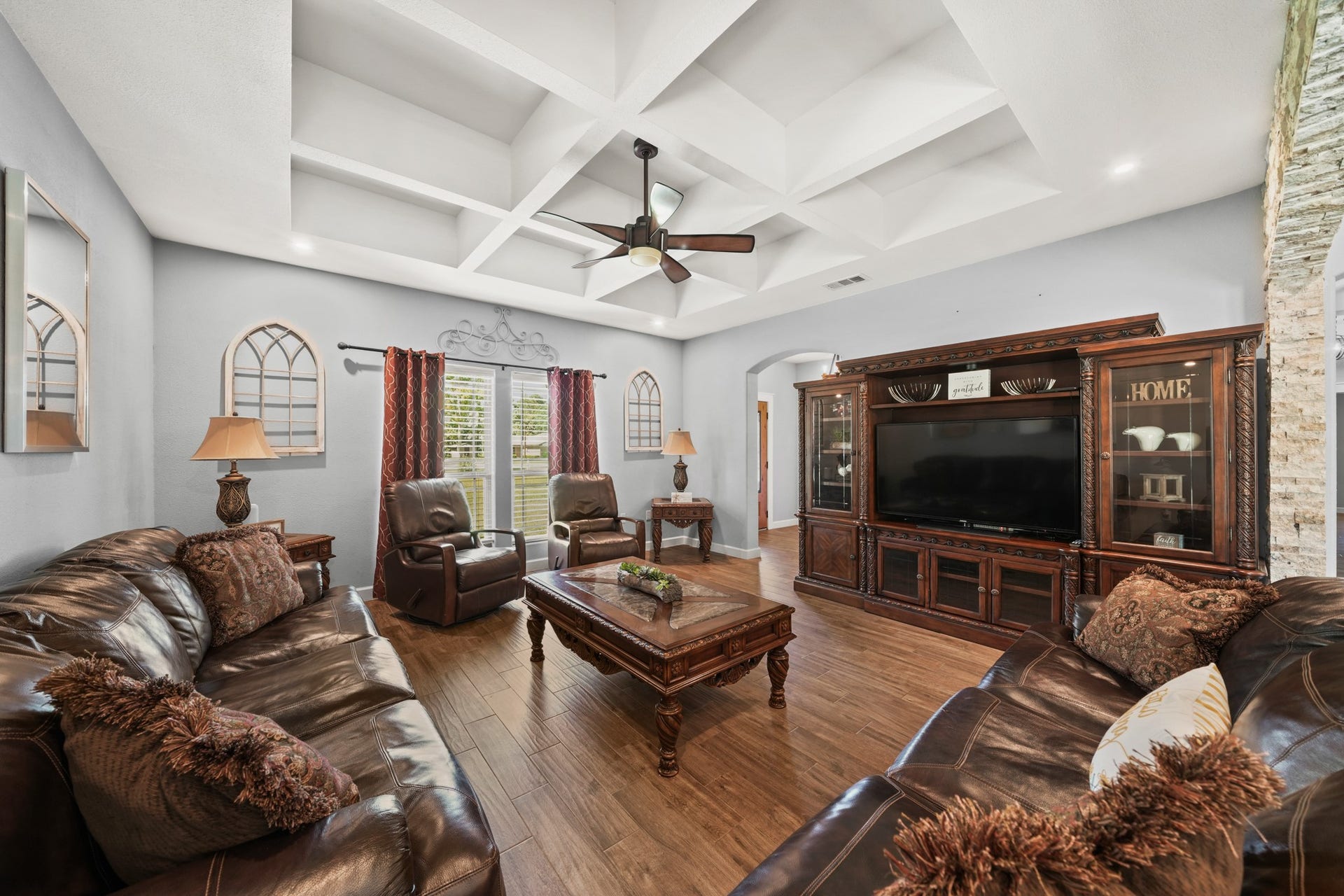 11021 32nd Street, Santa Fe, TX 77510 Living Room Detail: Highlights the coffered ceiling and massive entertainment center