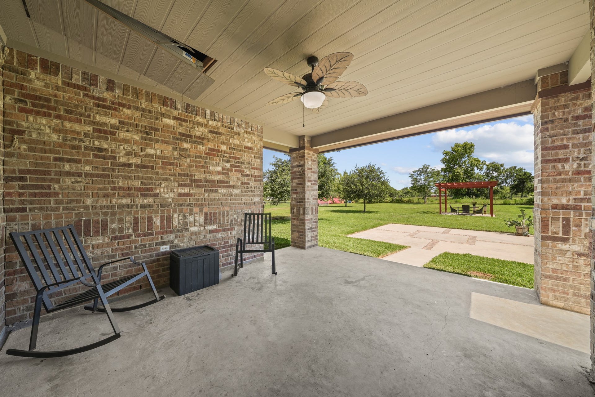 11021 32nd Street, Santa Fe, TX 77510 Covered Patio: Ground-level view looking out from the back patio