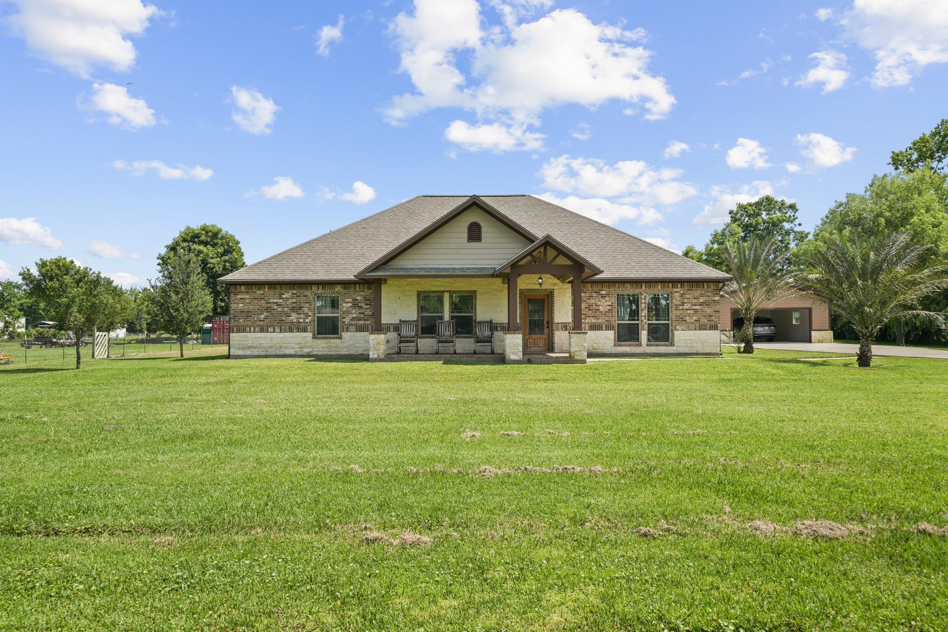 11021 32nd Street, Santa Fe, TX 77510 This home features a classic and crisp ground-level front elevation, perfectly centered to welcome you with charm and elegance.