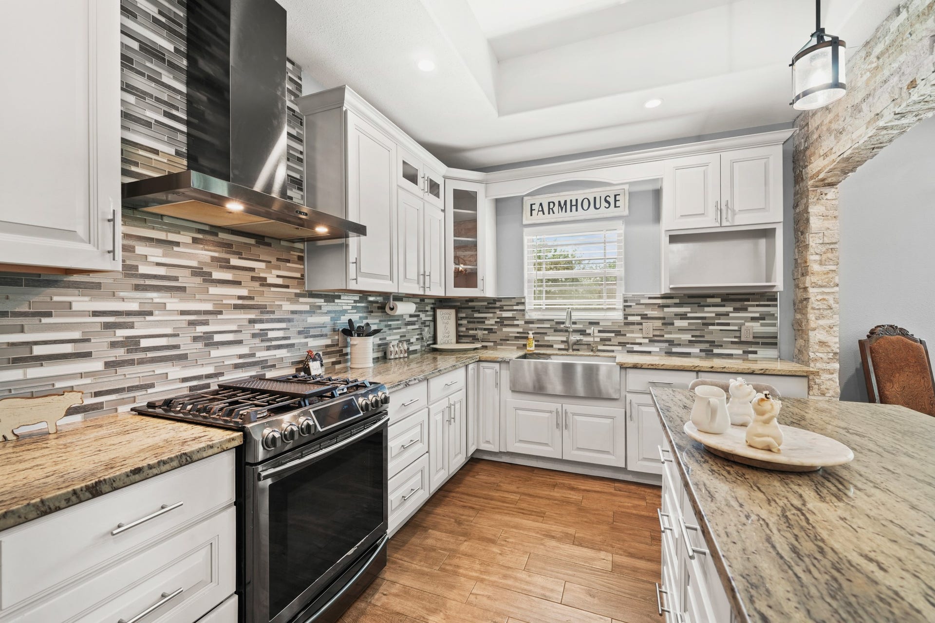 11021 32nd Street, Santa Fe, TX 77510 Kitchen Work Zone: The absolute best angle to show off the custom mosaic backsplash, vent hood, and pro-style range