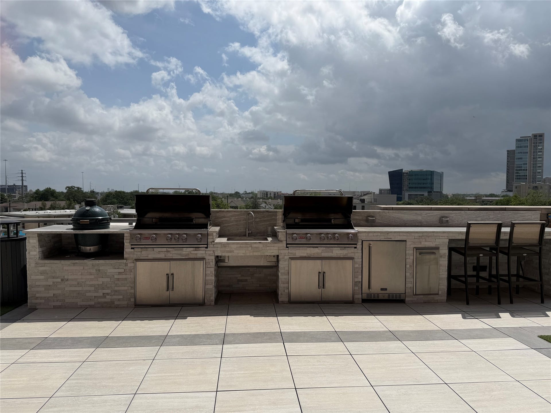 Gas grills, smoker and mini fridge available in the pool area