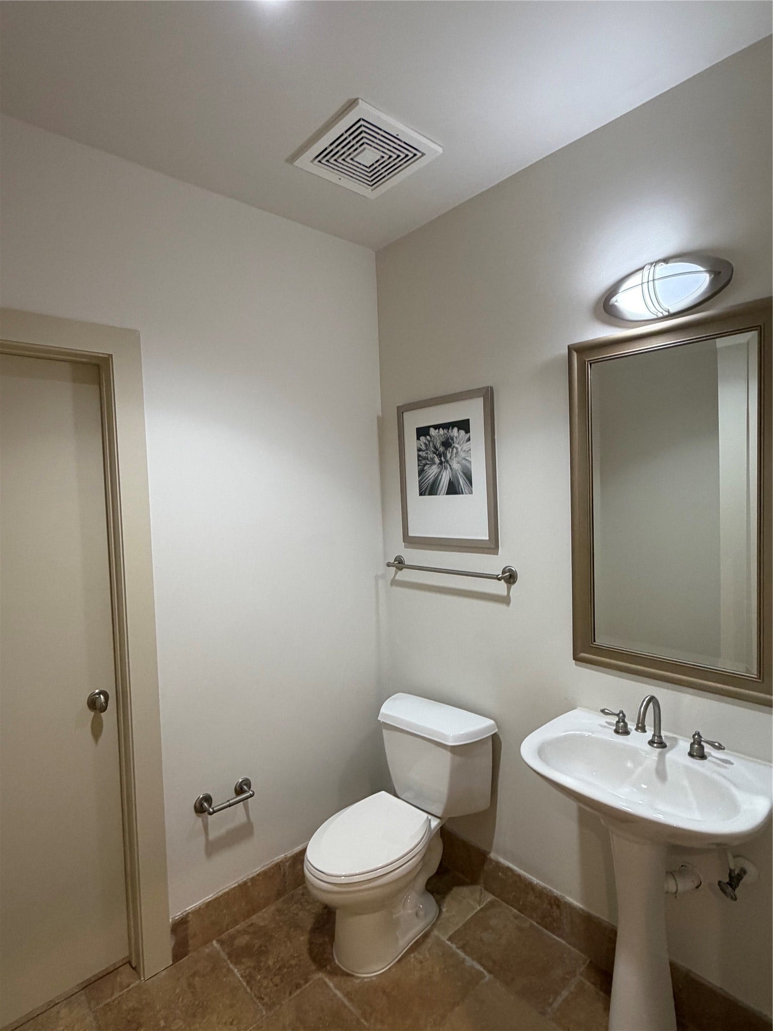 Separate water closet also functions as the powder room off the formal entrance.