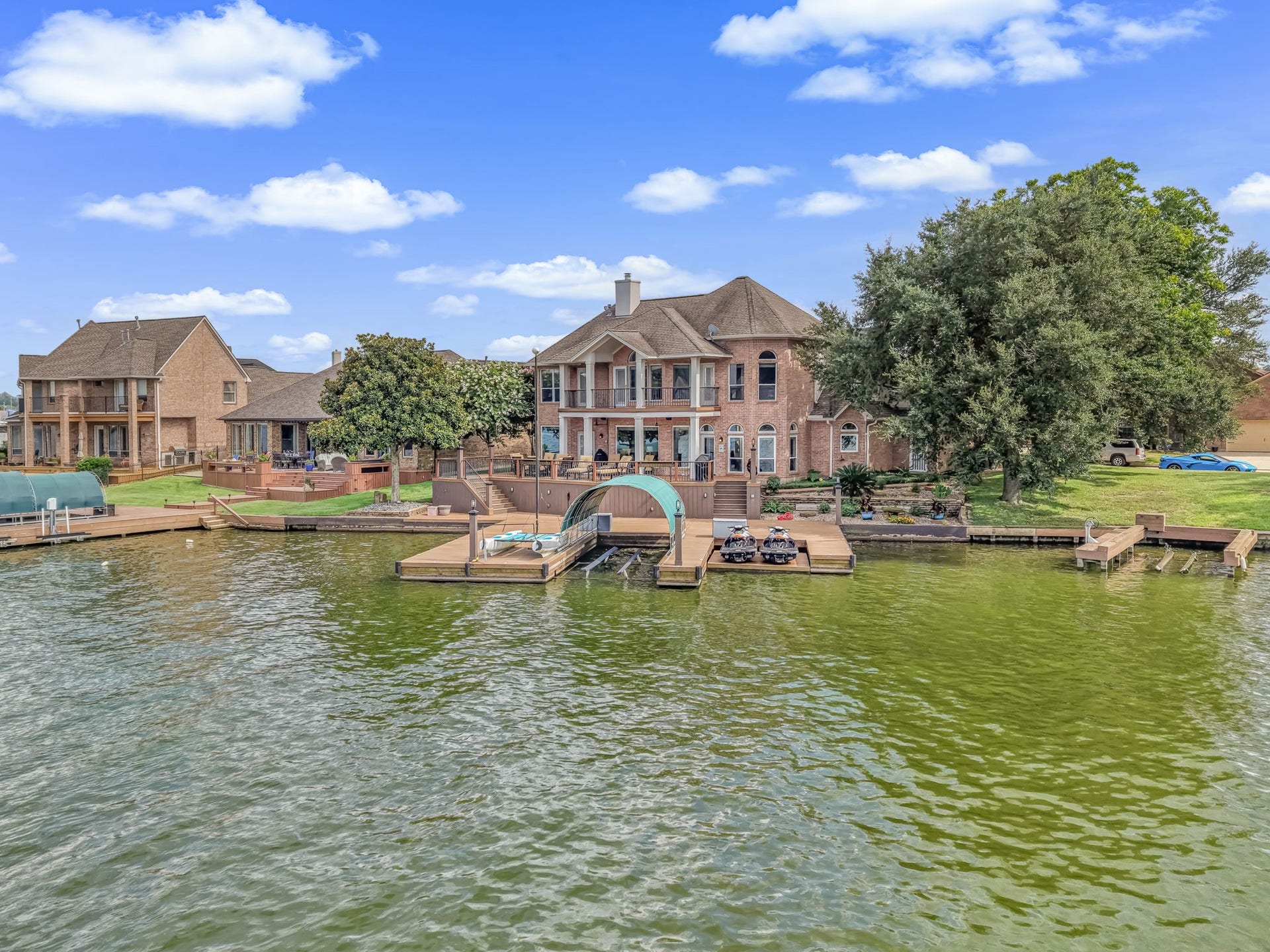 318 Bayshore Drive, Montgomery, TX 77356 Welcome Home! 318 Bayshore Dr in South Shore Estates! in the full beauty of this exceptional waterfront estate from the lake, where its impressive architecture, expansive shoreline, private boat and jet ski lifts, and beautifully designed outdoor spaces create a truly unforgettable lakeside presence.