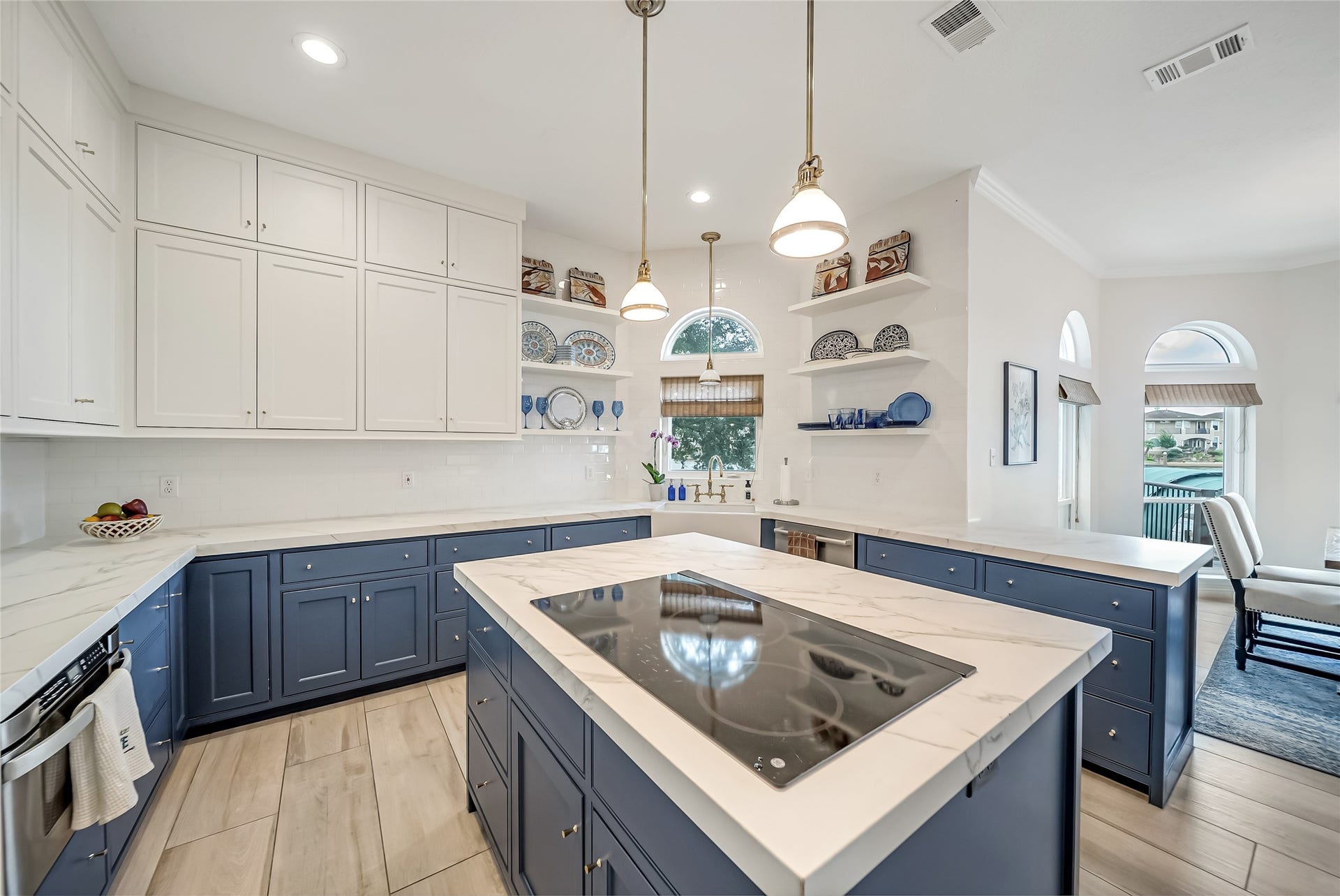 318 Bayshore Drive, Montgomery, TX 77356 Designed with both beauty and functionality in mind, the kitchen offers exceptional storage, expansive workspace, and a layout that keeps everyone connected without sacrificing style.