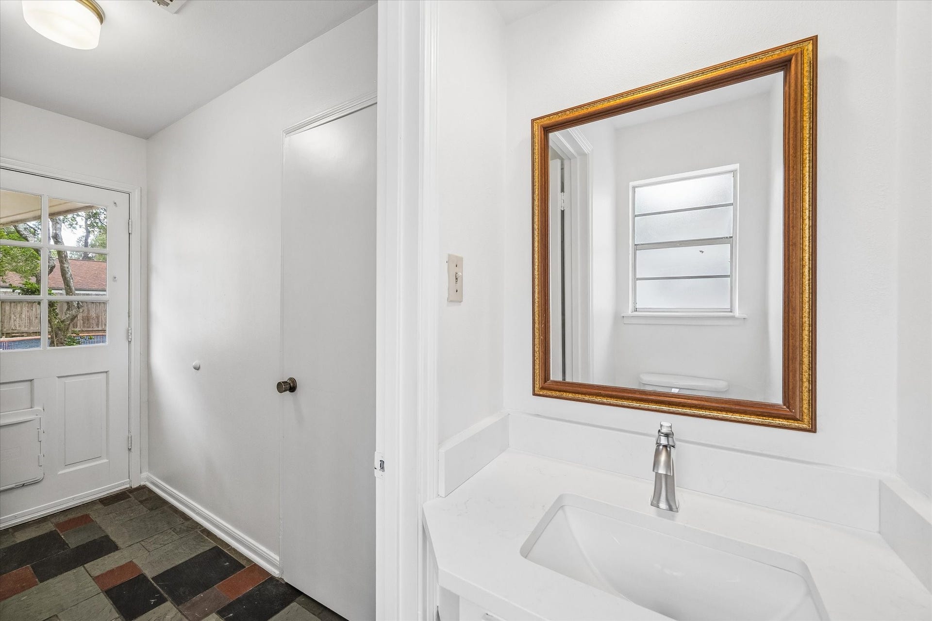 The powder bath is off the laundry room.
