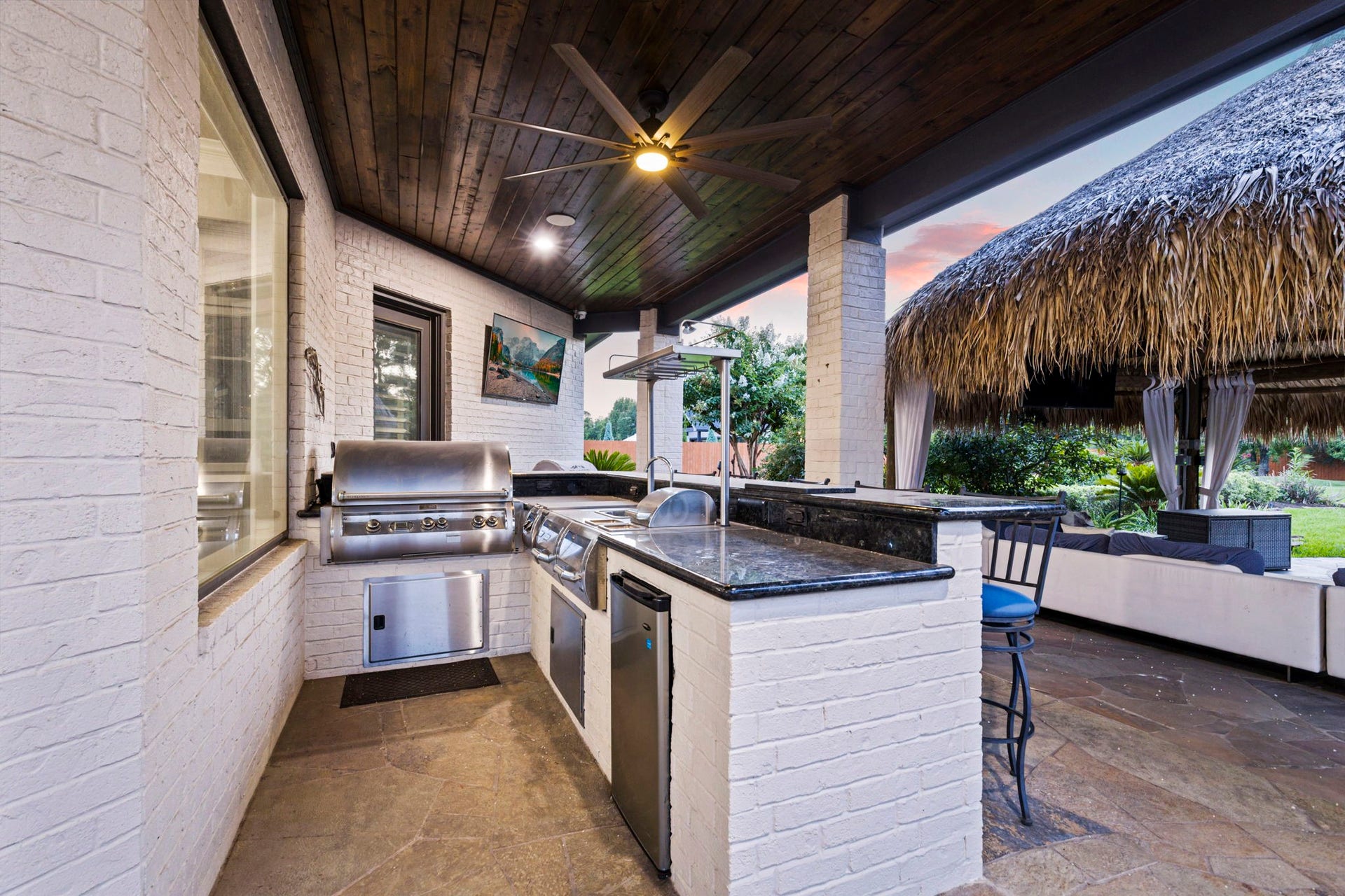 7930 Spring Village Drive, Spring, TX 77389 Outdoor kitchen with fridge.