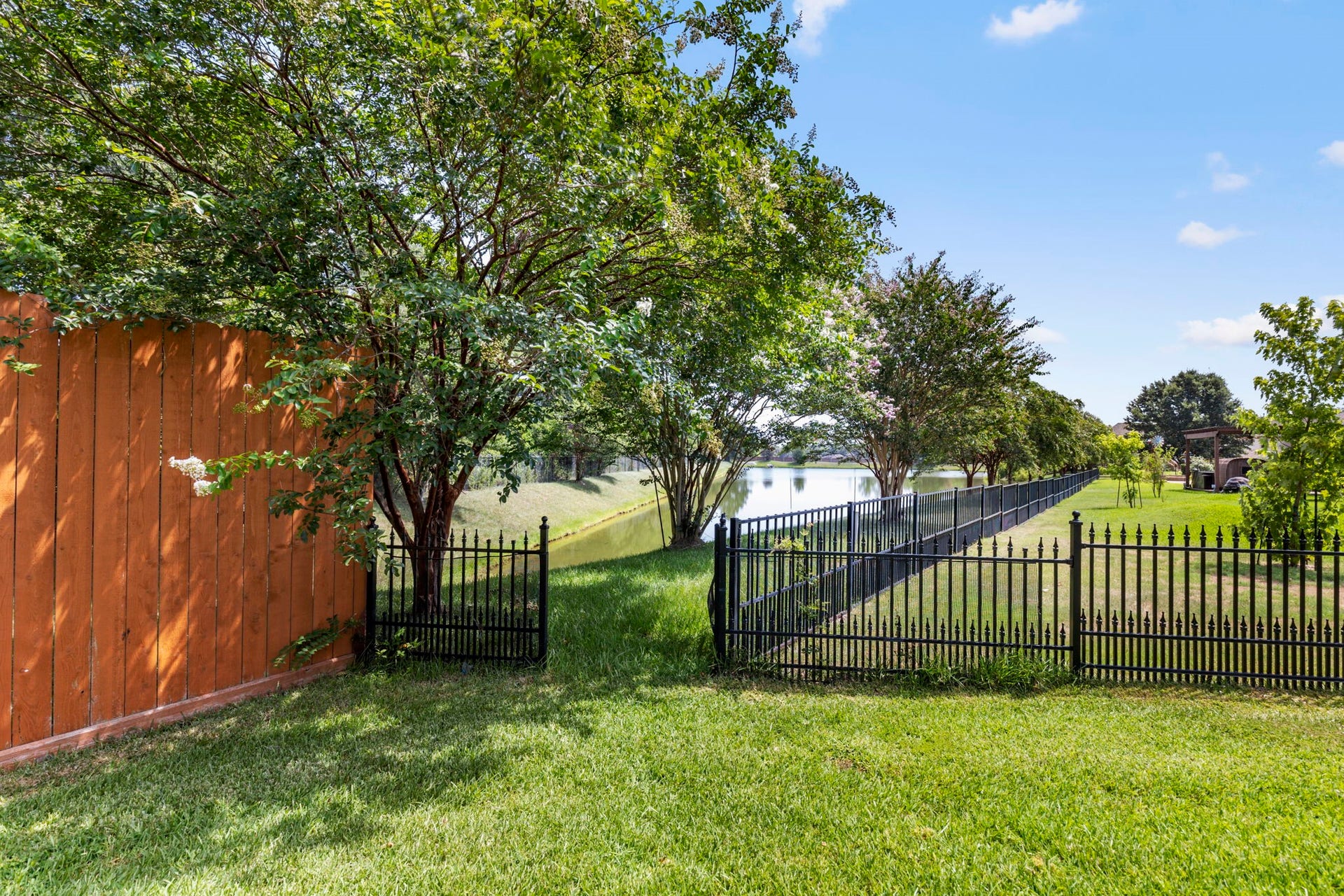 7930 Spring Village Drive, Spring, TX 77389 Private gate to community lake.