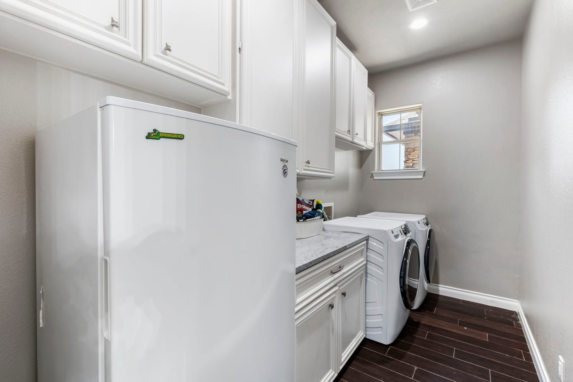 7930 Spring Village Drive, Spring, TX 77389 Large laundry room has plenty of cabinets and counter space.