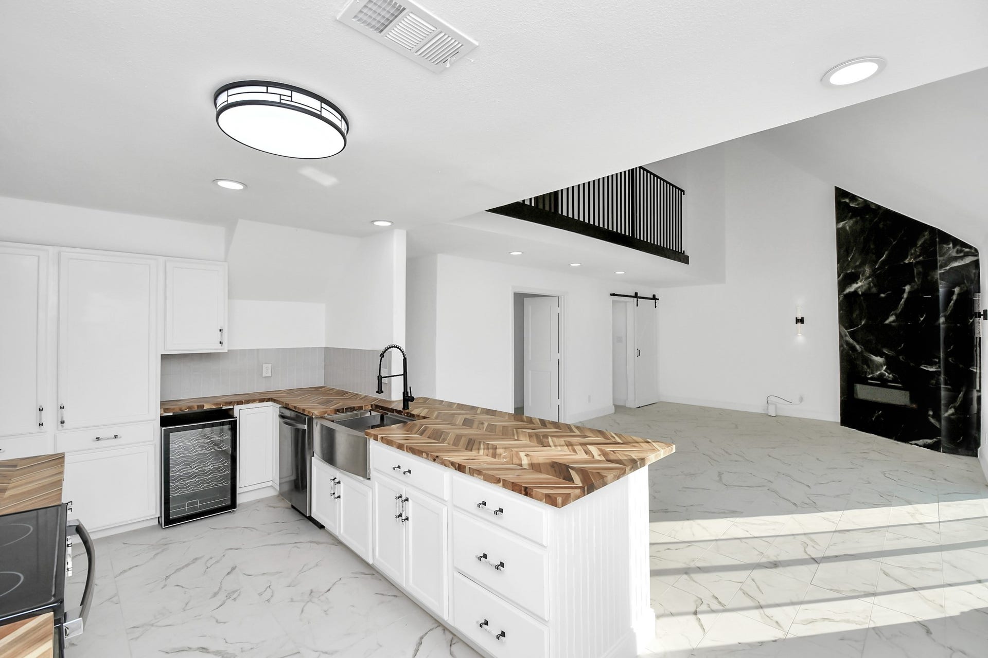 6035 Cartagena Street, Houston, TX 77035 The kitchen is beautifully equipped with sleek modern finishes, yet fully prepared to meet the needs of any chef.