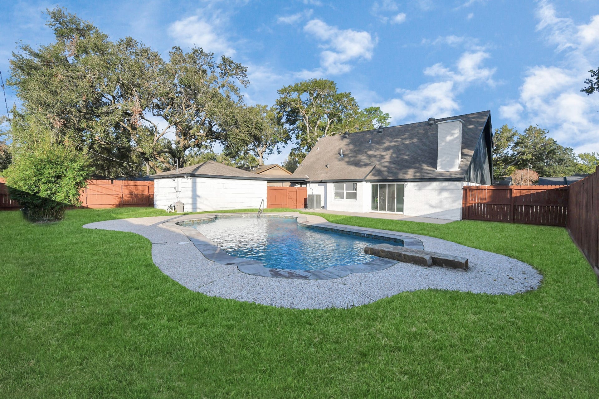6035 Cartagena Street, Houston, TX 77035 The massive backyard boasts an oversized, luxurious pool, perfectly designed for enjoying those hot Texas summers.