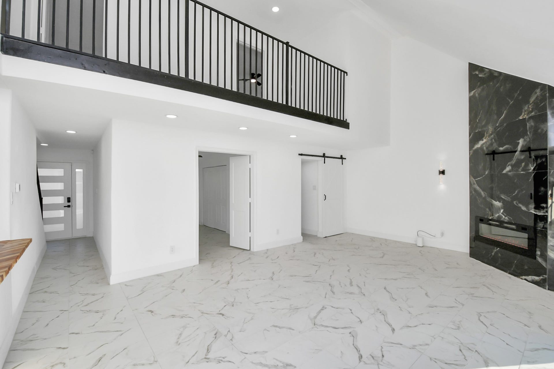6035 Cartagena Street, Houston, TX 77035 A wrought iron railing accents the catwalk, enhancing the home's architectural charm and overall appeal.