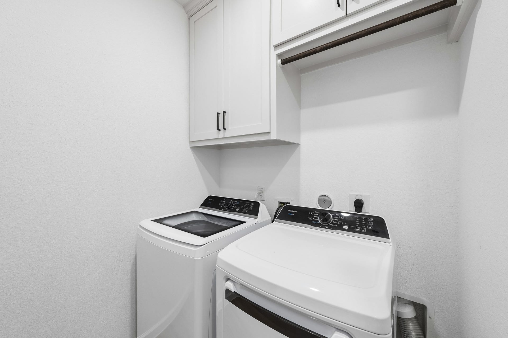2118 Cottage Bridge Road, League City, TX 77573 Laundry room had built-in cabinets added along with hanging rod for ease of use on laundry day.