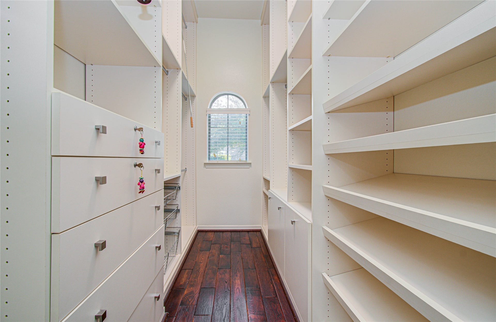 Expansive closet in the primary bathroom with ample shelving and storage.