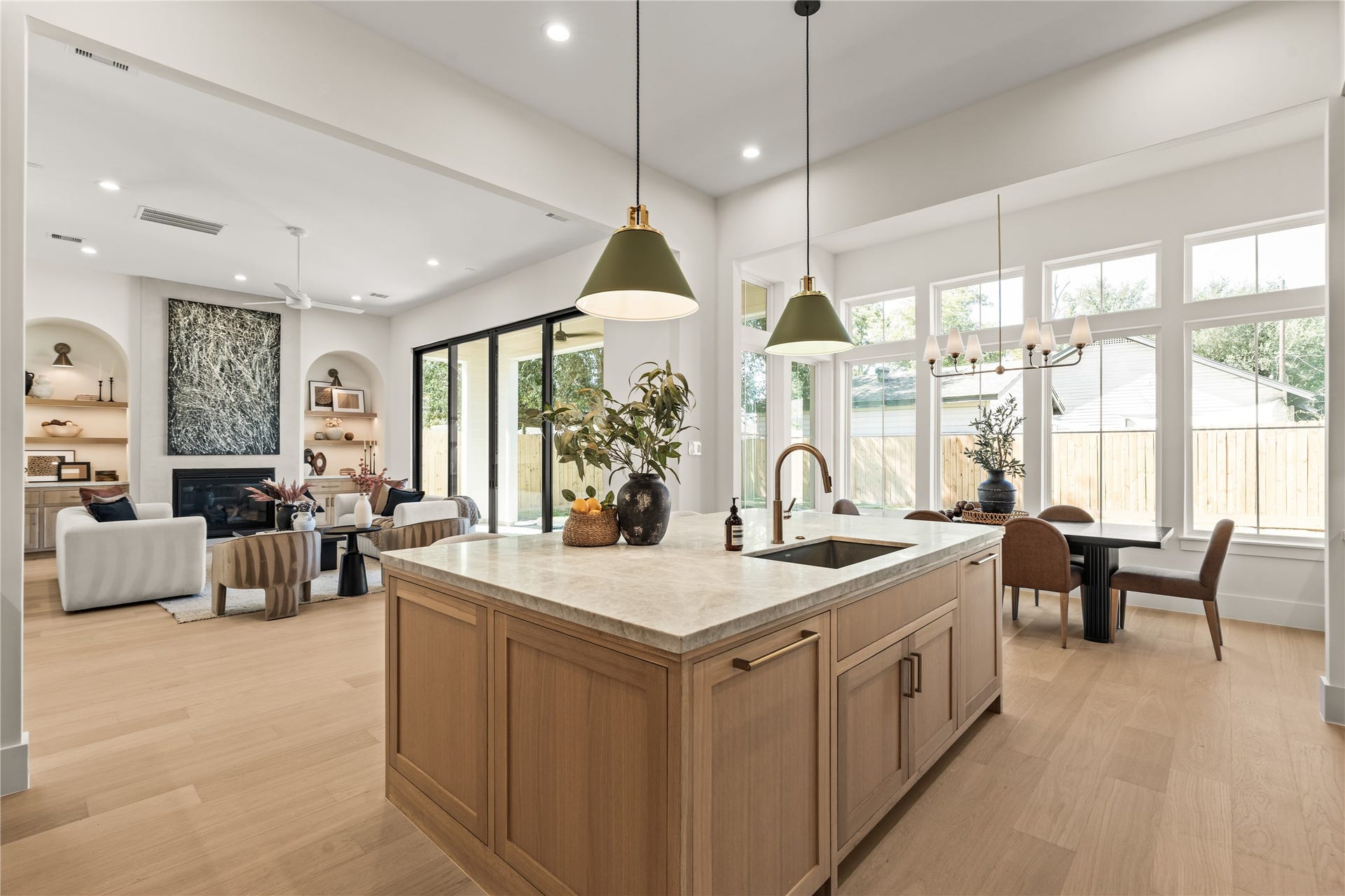 2011 Singleton Street, Houston, TX 77008 Chef's kitchen features a large island with storage cabinets on both sides of the island, top grade Brazilian Taj Mahal Quartzite (natural stone), white oak custom-built inset cabinetry with weighty solid brass champagne bronze pulls, and Fisher & Paykel luxury appliances. The 48" gas range was upgraded to dual fuel (ideal for those who like to bake).