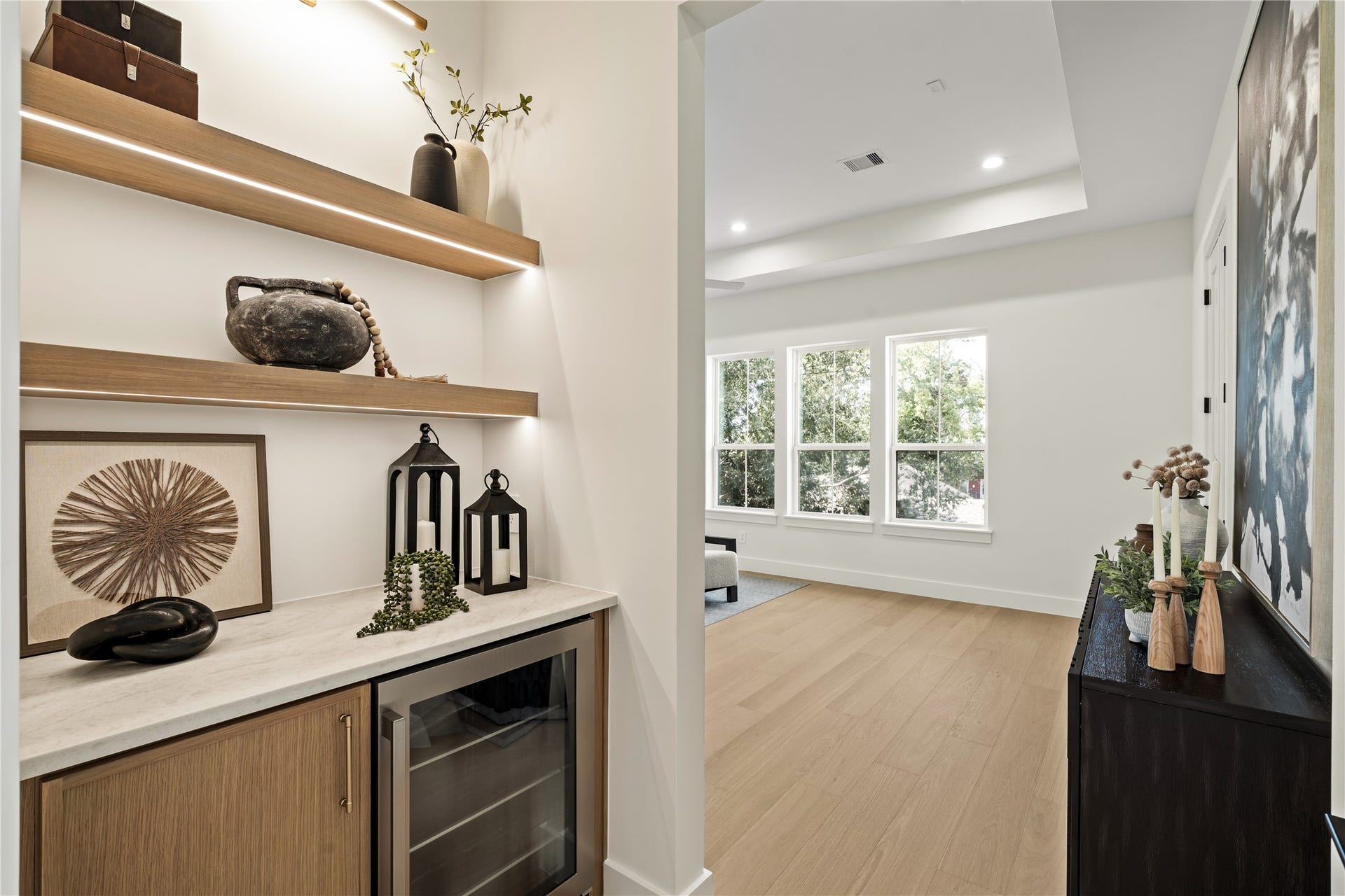 2011 Singleton Street, Houston, TX 77008 As you enter the primary bedroom suite, you're welcomed by a coffee bar complete with beverage fridge.