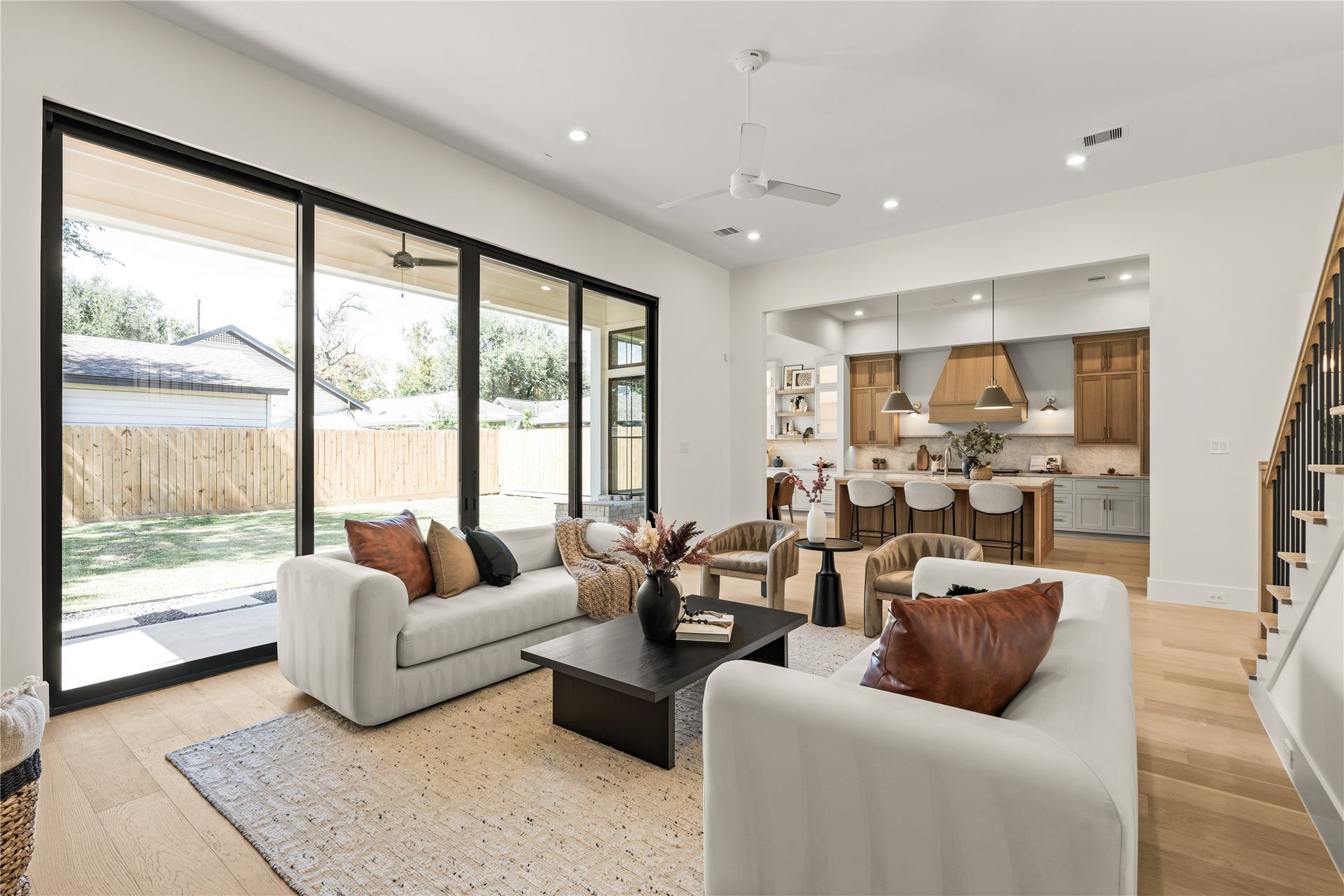 2011 Singleton Street, Houston, TX 77008 Enjoy your large living room with a Venetian plastered fireplace, arched storage nooks with white oak shelving, and a 16' wide aluminum glass sliding door leading to the back patio.