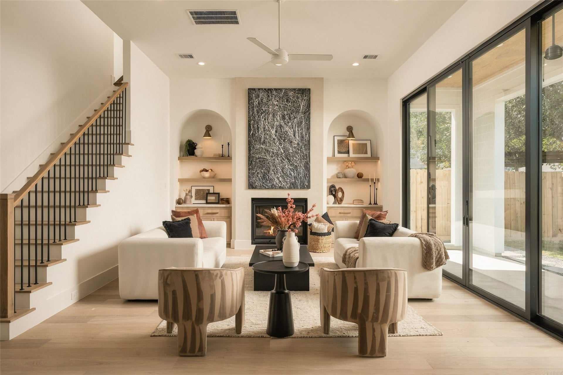 2011 Singleton Street, Houston, TX 77008 Enjoy your large living room with a Venetian plastered fireplace, arched storage nooks with white oak shelving, and a 16' wide aluminum glass sliding door leading to the back patio.