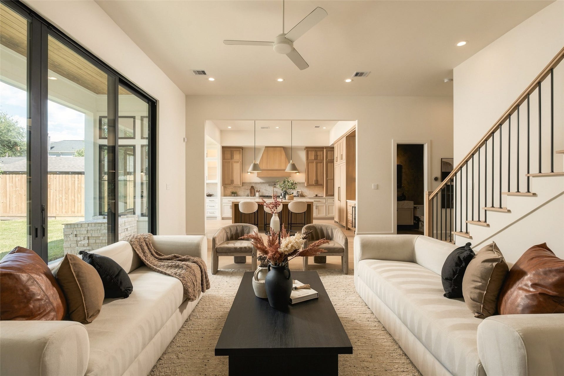 2011 Singleton Street, Houston, TX 77008 Enjoy your large living room with a Venetian plastered fireplace, arched storage nooks with white oak shelving, and a 16' wide aluminum glass sliding door leading to the back patio.