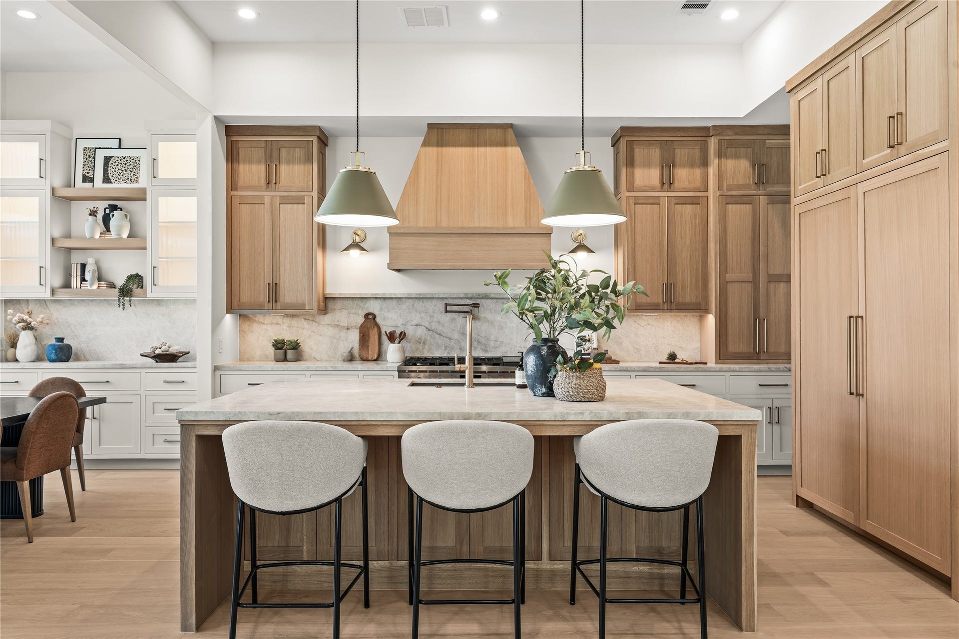 2011 Singleton Street, Houston, TX 77008 Chefs kitchen features a large island with storage cabinets on both sides of the island, top grade Brazilian Taj Mahal Quartzite (natural stone), white oak custom-built inset cabinetry with weighty solid brass champagne bronze pulls, and Fisher & Paykel luxury appliances. The 48" gas range was upgraded to dual fuel (ideal for those who like to bake). Panels hide the 30" column fridge and freezer.