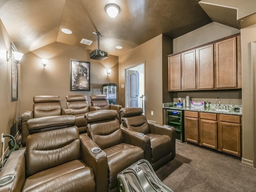 2210 Pearl Bay Court, Pearland, TX 77584 Experience ultimate movie nights in your private home theater, add your plush seating and enjoy the convenient snack bar.
