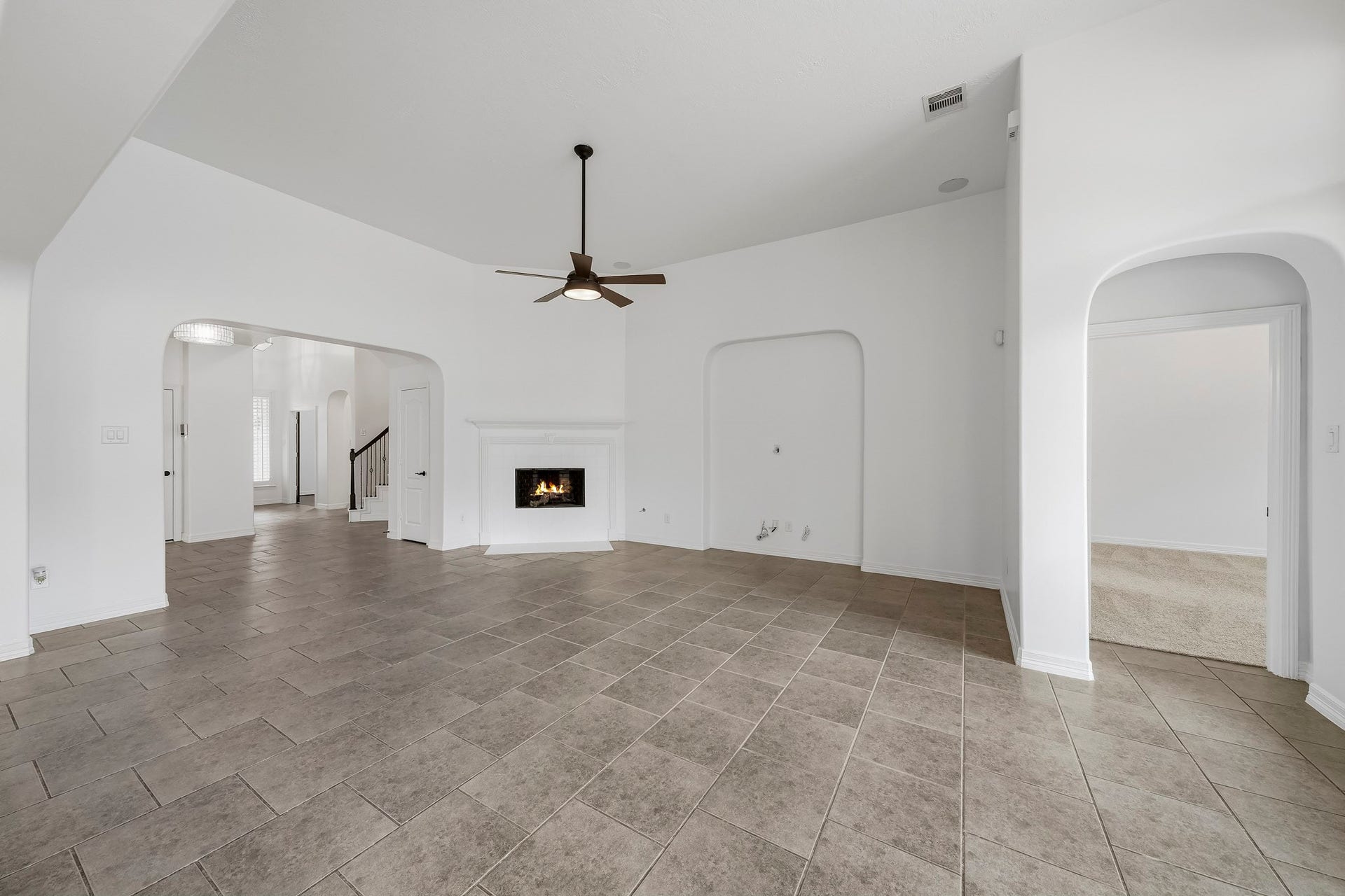 28906 Davenport Drive, Katy, TX 77494 another view of the living room showing the fireplace and primary hallway