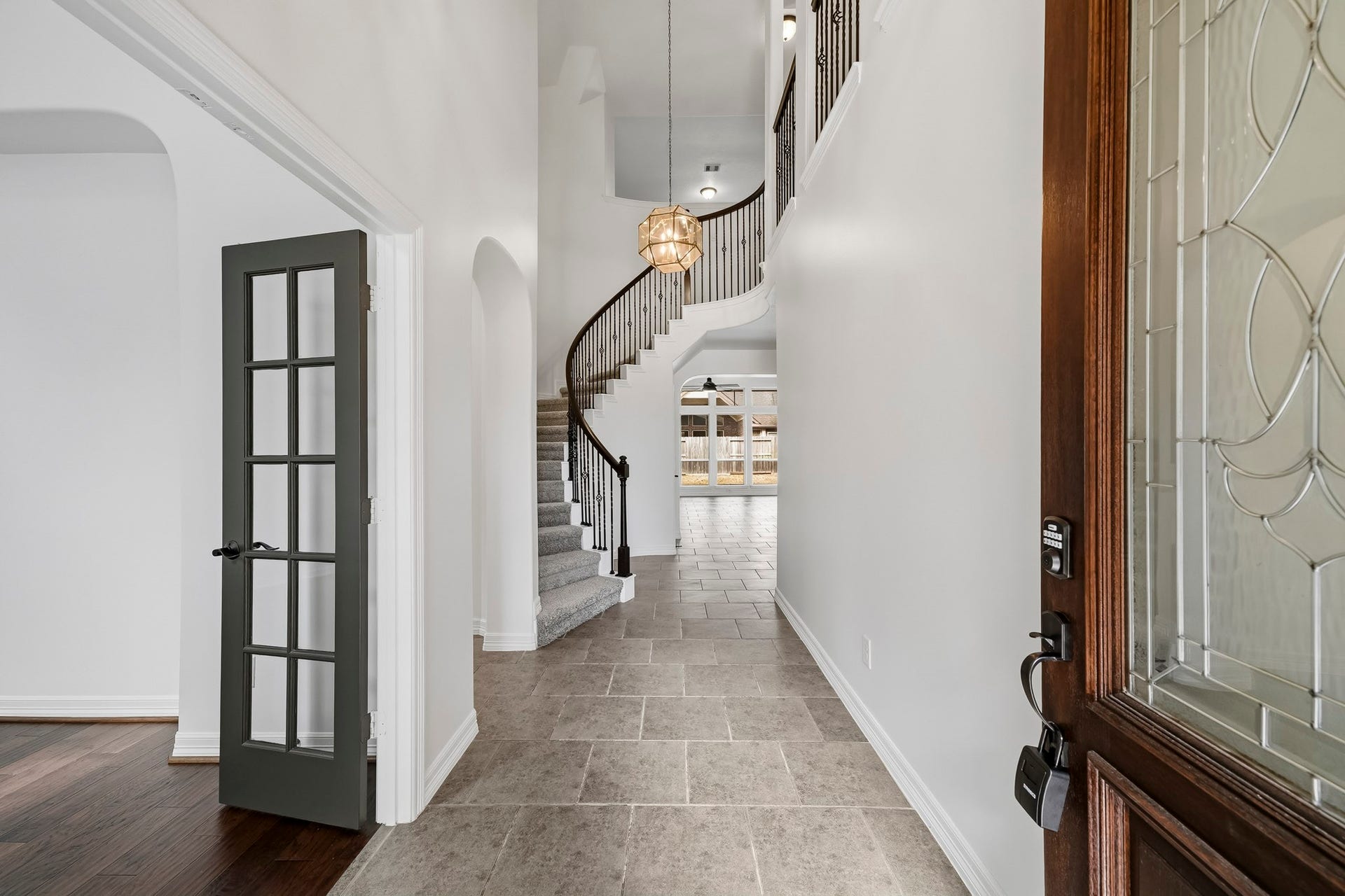 28906 Davenport Drive, Katy, TX 77494 Inviting entry with study to left, tall ceilings and stunning spiral staircase