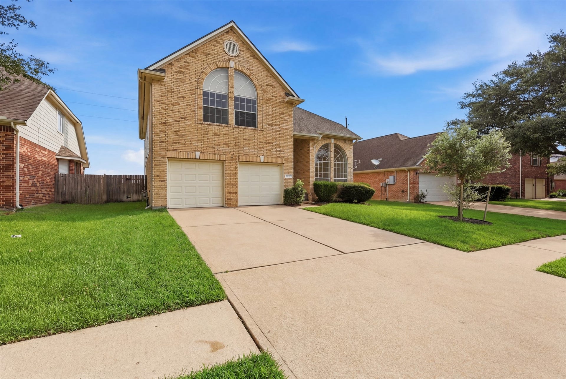 16622 Stoneside Drive, Houston, TX 77095 An angled perspective captures the property's pitched roofline and generous side yard layout.