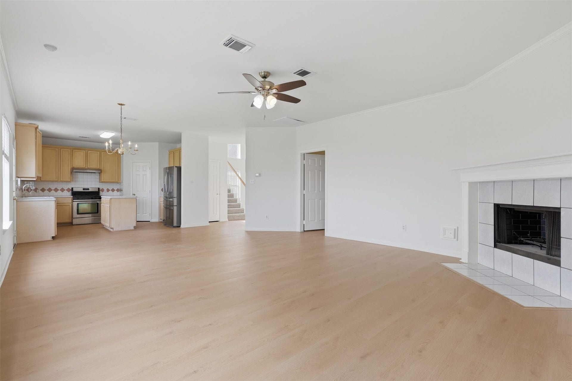 16622 Stoneside Drive, Houston, TX 77095 The generous family zone provides a seamless line of sight into the kitchen, emphasizing a fluid and connected layout.