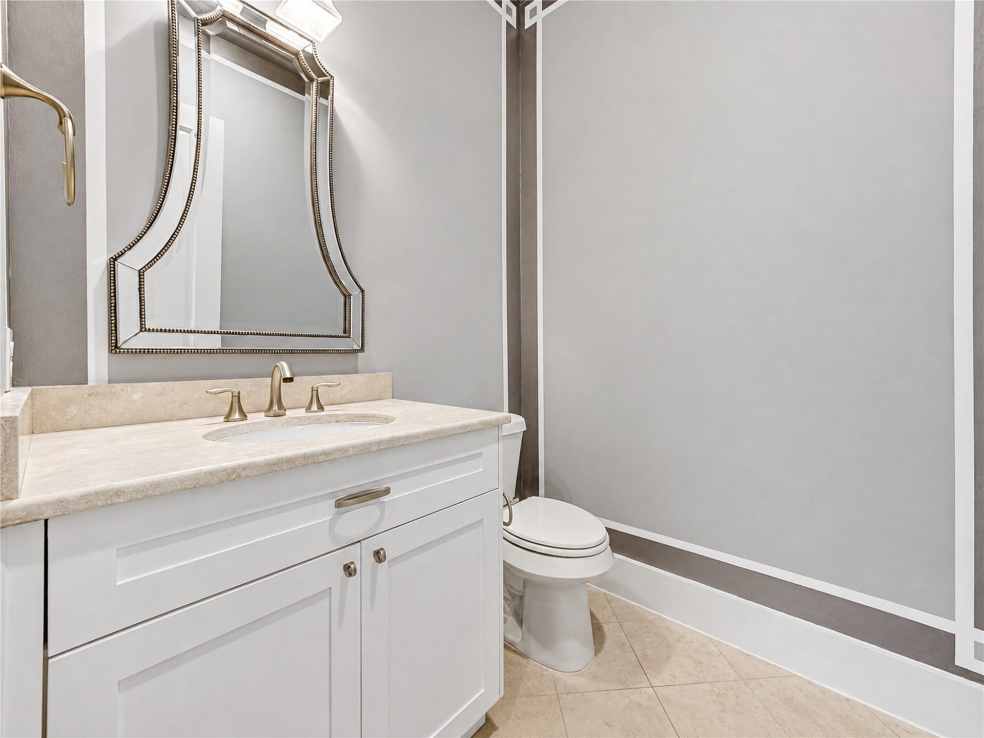 Conveniently located on the first floor, the elegant powder bath is thoughtfully positioned for guests.