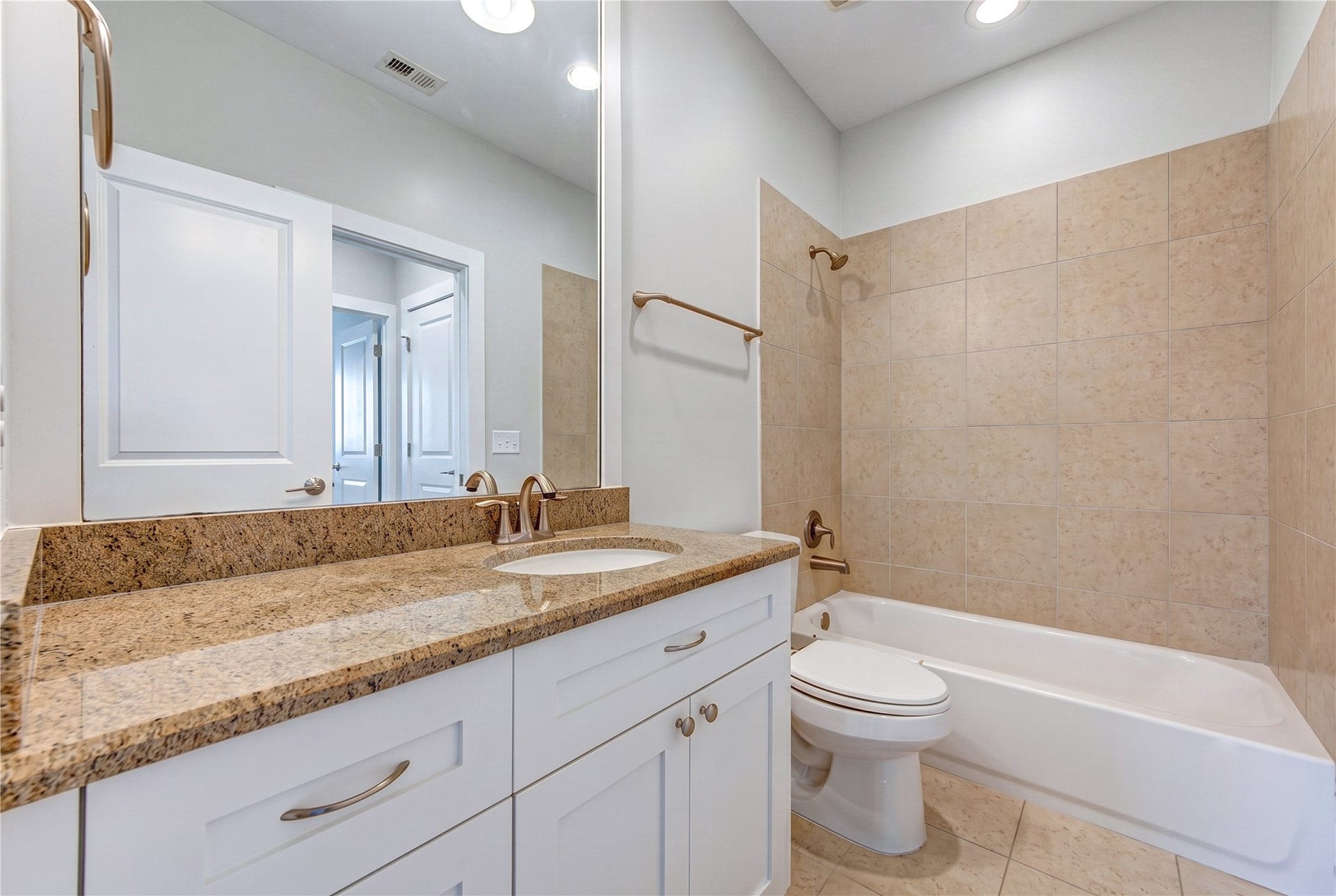 Thoughtfully designed with dual access from the secondary bedroom and hallway, this full bath features a tub and shower combination.