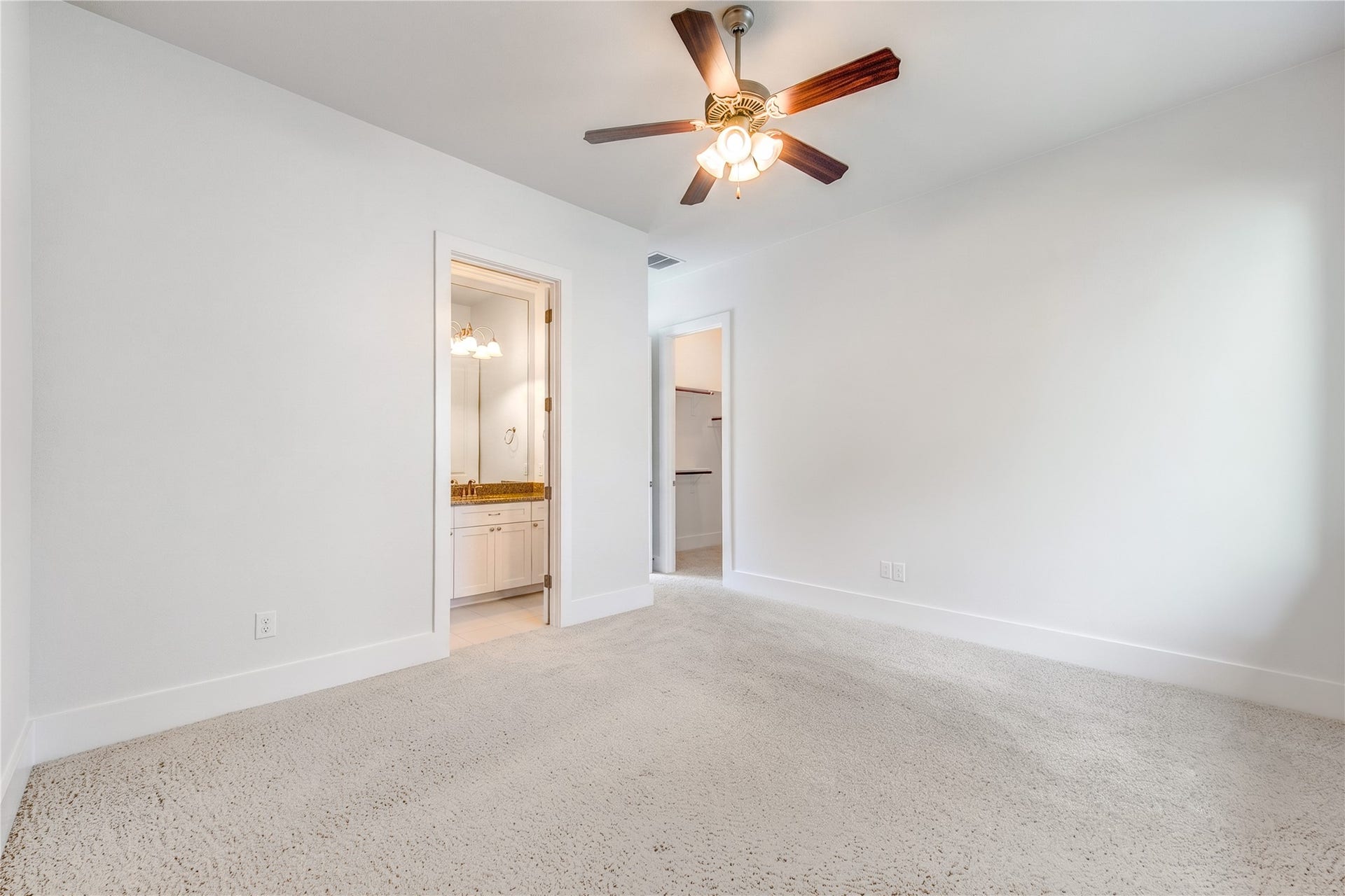 The secluded first-floor secondary suite offers exceptional privacy with an en-suite bath and walk-in closet- ideal for overnight guests or multigenerational living.