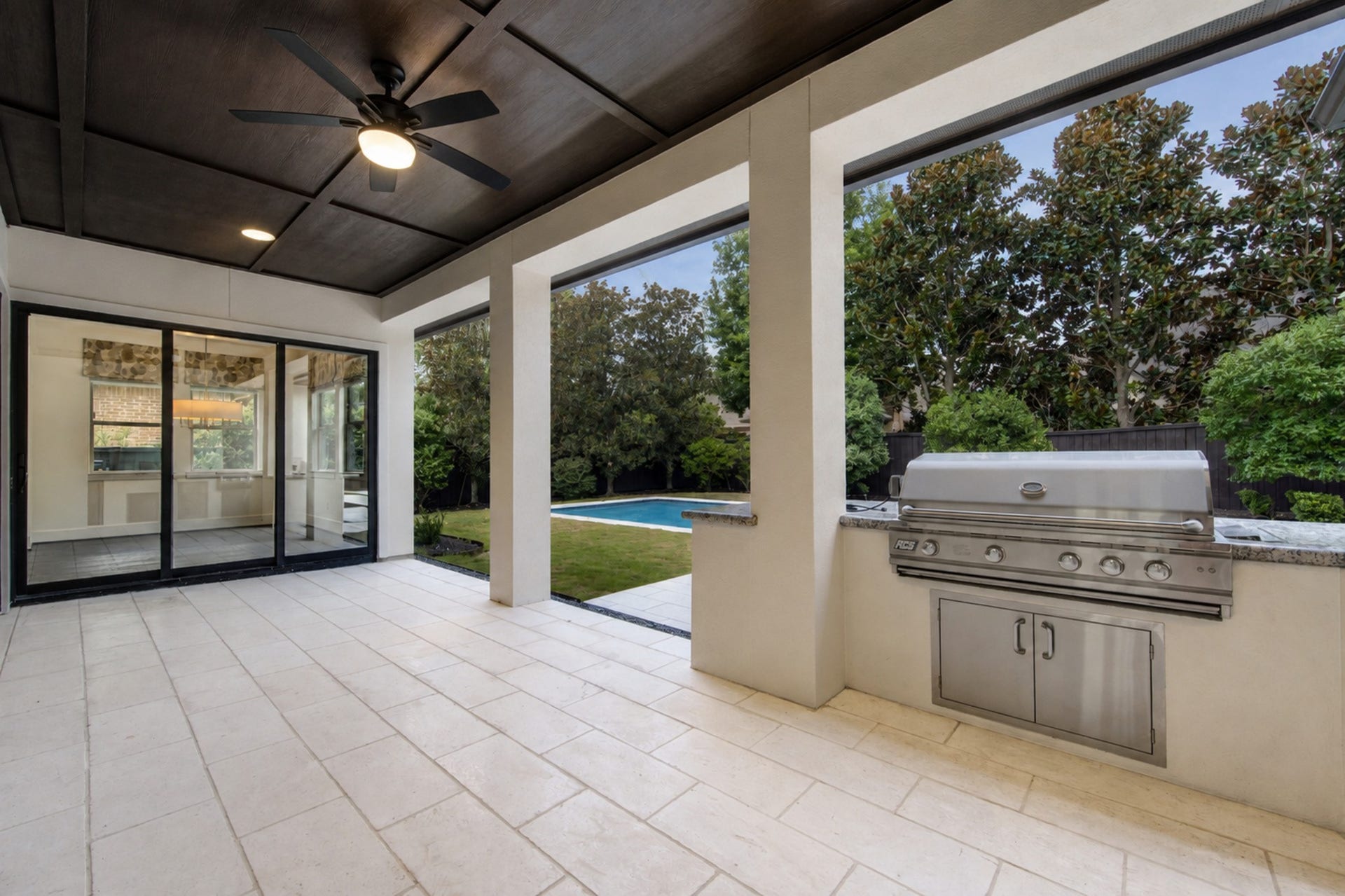 A built-in grill and generous coveted patio create the ultimate setting for poolside meals, weekend gatherings and relaxed outdoor living.