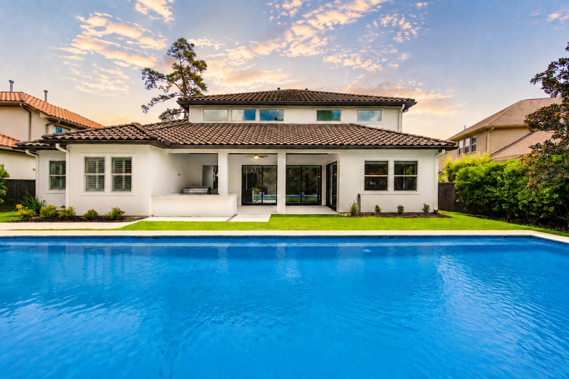 A resort-inspired backyard oasis with a sparkling pool and spa sets the stage for efforles outdoor living and unforgettable entertaining.