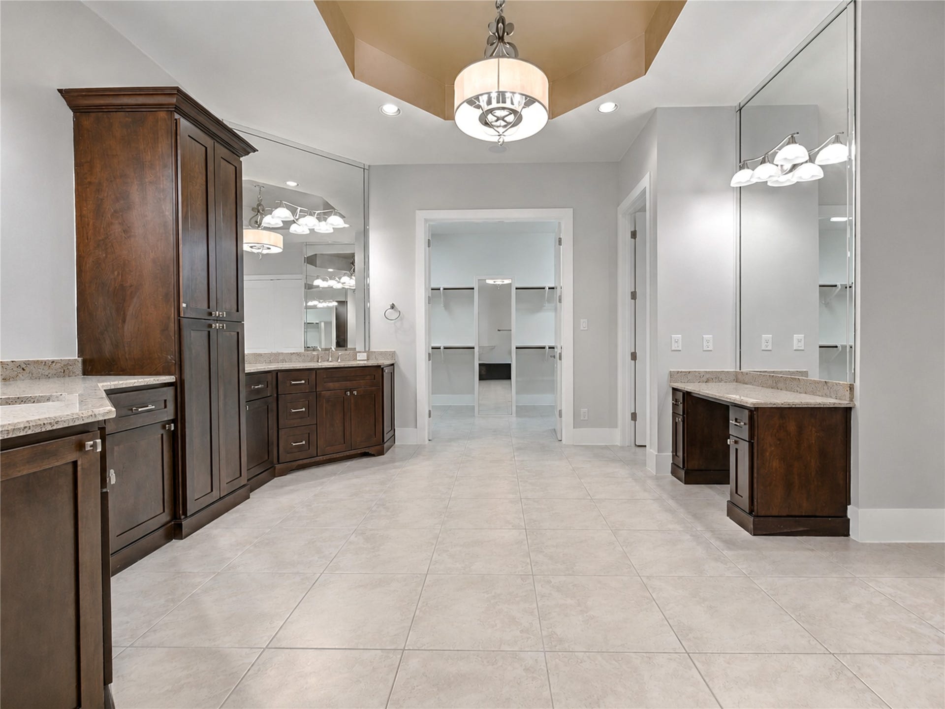 The spa-inspired primary bath connects directly to an expansive walk-in closet, completing the thoughtfully designed and highly functional primary suite.