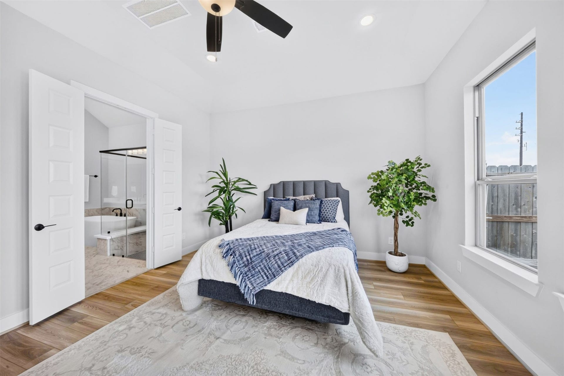32510 Ebony Jewelwing Court, Fulshear, TX 77441 Primary Bedroom: Serene primary suite offers generous proportions, abundant natural light, high ceilings, and direct access to the luxurious ensuite bath.