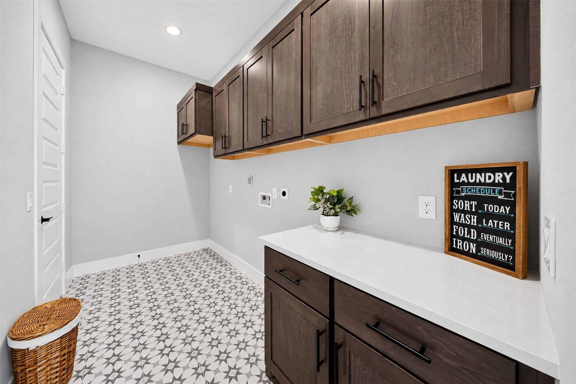 32510 Ebony Jewelwing Court, Fulshear, TX 77441 Laundry Room Spacious utility room with extensive upper and lower cabinetry, generous countertop workspace, and stylish patterned flooring.
