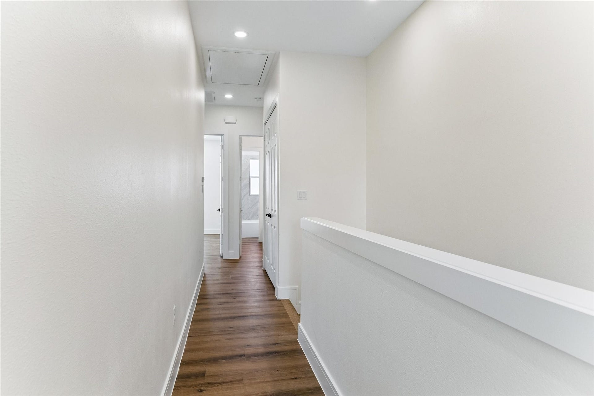 5106 Ricky Street, #A, Houston, TX 77033 Hallway leading from primary bedroom to guest rooms and upstairs laundry area.