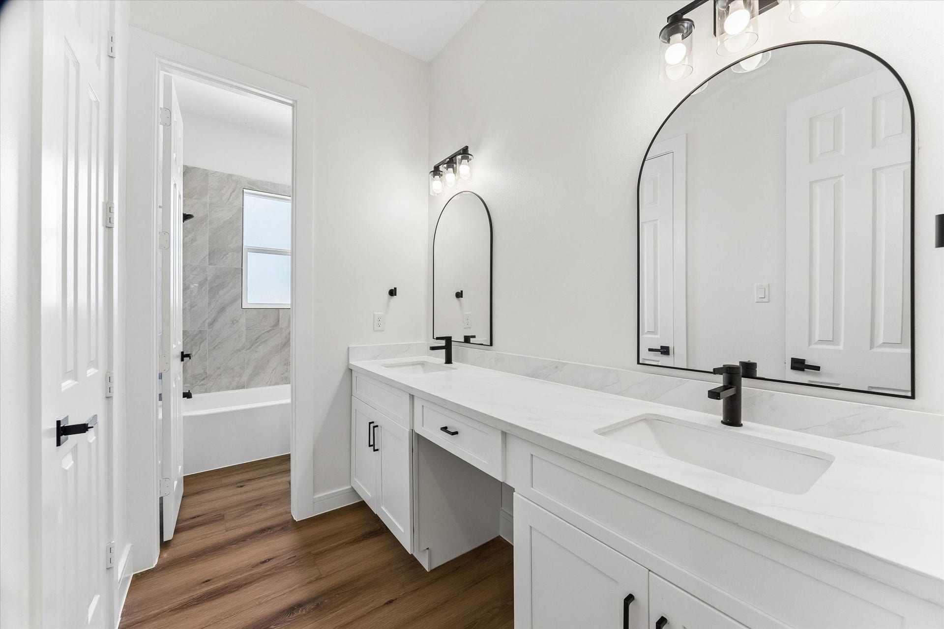 5106 Ricky Street, #A, Houston, TX 77033 Secondary bathroom with separate area for shower and vanity offering two sinks.