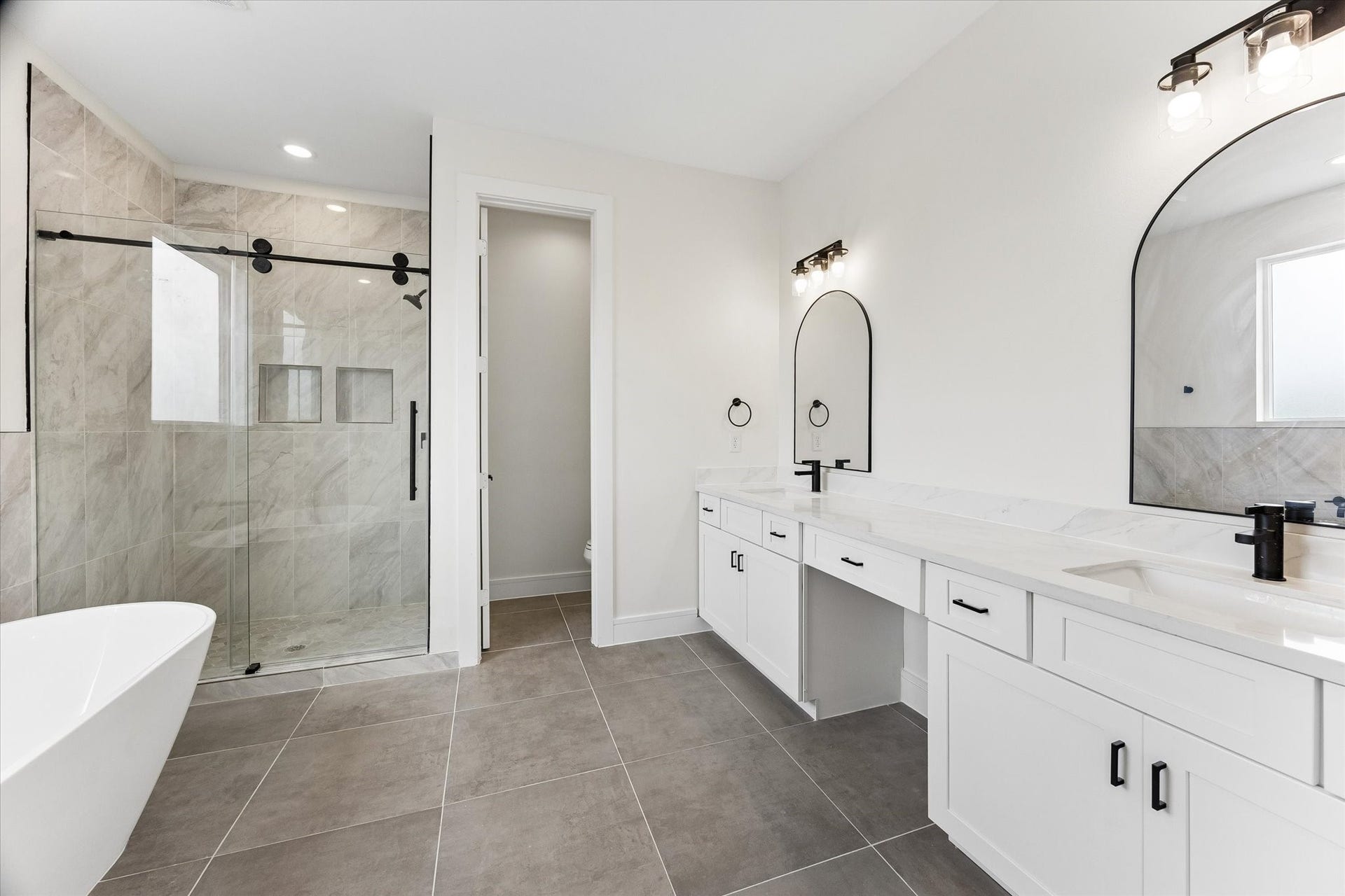 5106 Ricky Street, #A, Houston, TX 77033 Primary bathroom offering both a tub and separate shower.