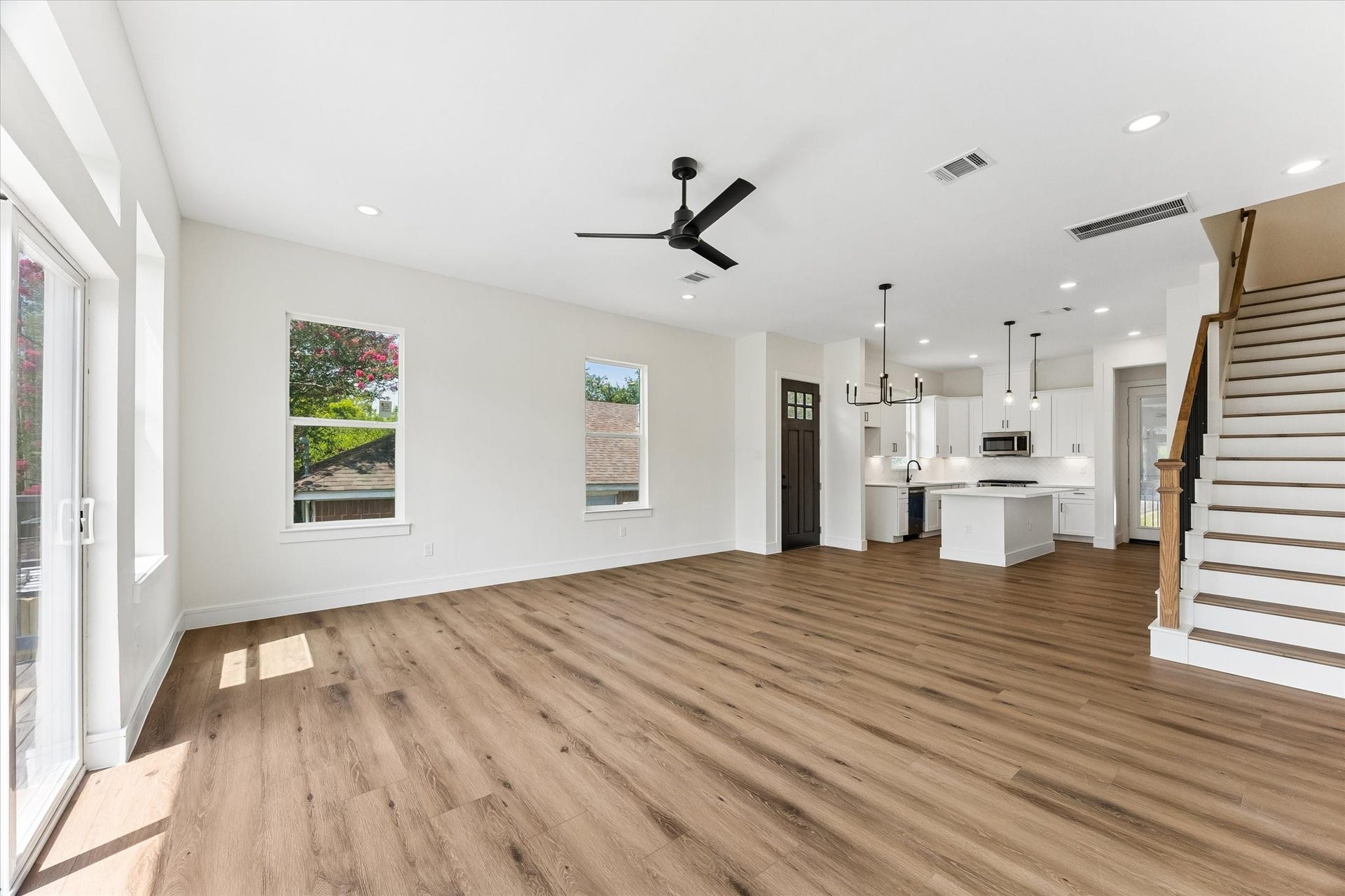 5106 Ricky Street, #A, Houston, TX 77033 Tall ceilings, doors throughout both units featuring laminate wood flooring throughout.