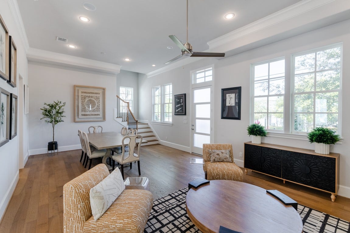 11053 Chatterton Drive, Houston, TX 77043 Natural light cascades into this spacious first floor living and dining area.